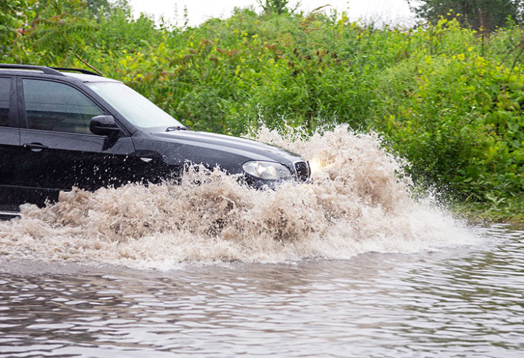 Car driving through flood in need of Auto Insurance in Quincy, MA, Alton, NH, Weymouth, Laconia, Hingham, and Surrounding Areas